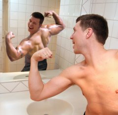 Skinny Male Sees Himself Muscular